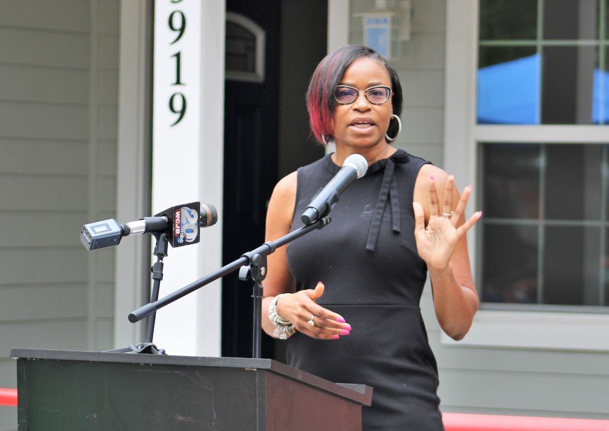 Angela Tharpe, chair of GHA, speaks at the ribbon cutting ceremony
