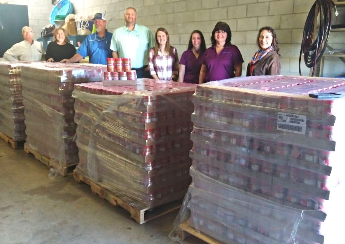 UF/IFAS Extension Levy County employees and Levy County Farm Bureau and Williston Peanut reps to receive large peanut butter donation