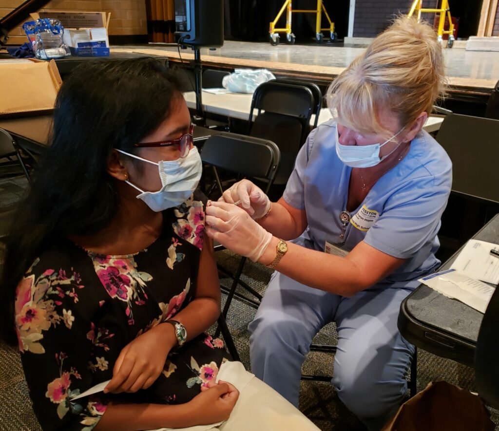 A file photo showing a Buchholz High School student receiving a COVID-19 vaccine last spring. Local schools are again busy vaccinating students since the recent FDA authorization of the Pfizer vaccine for children ages 5-11.