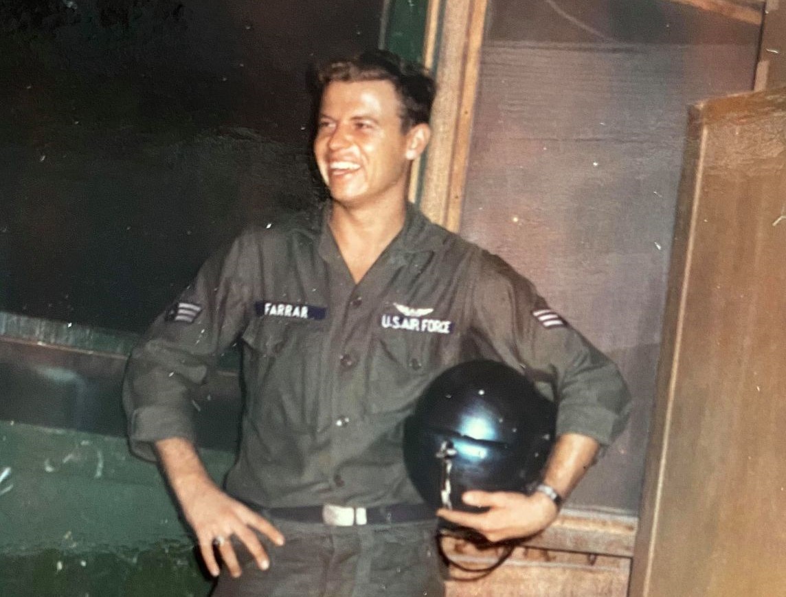 Mike Farrar in flight suit with helmet