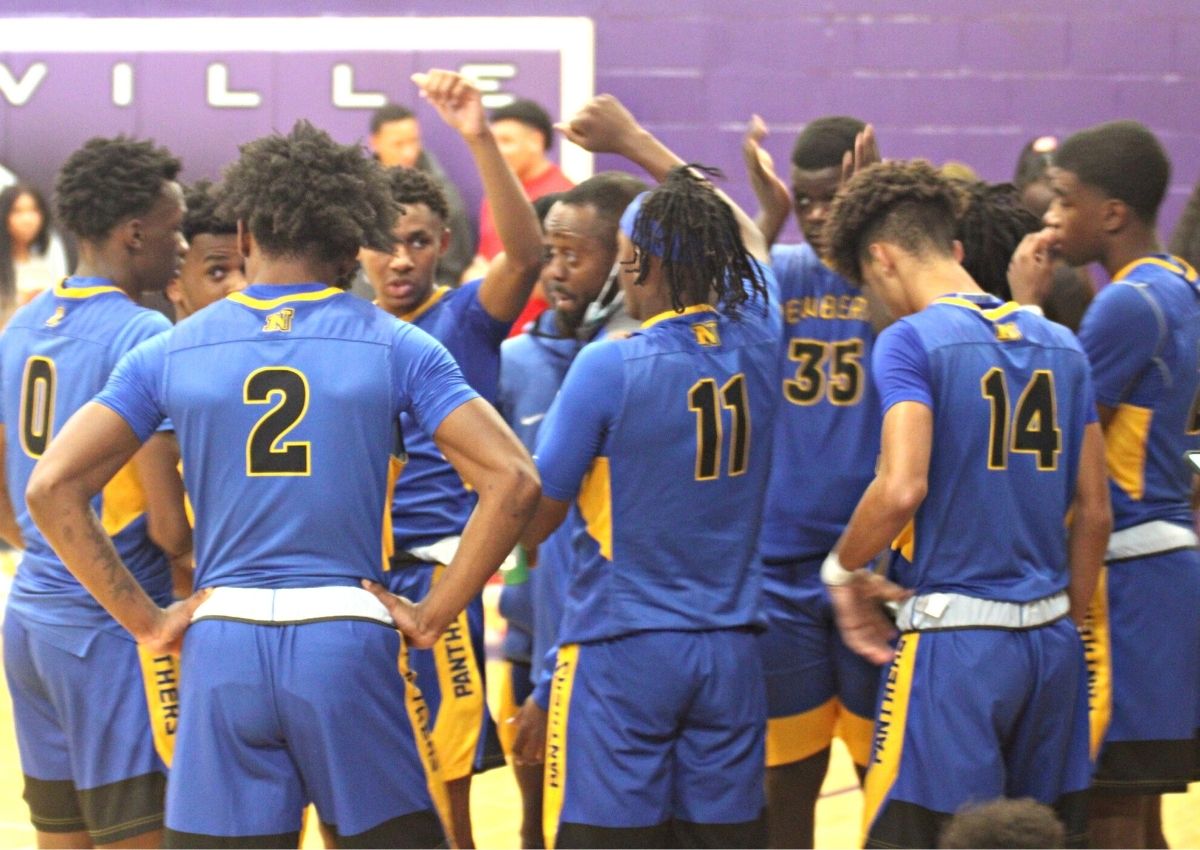 Newberry boys basketball team huddle