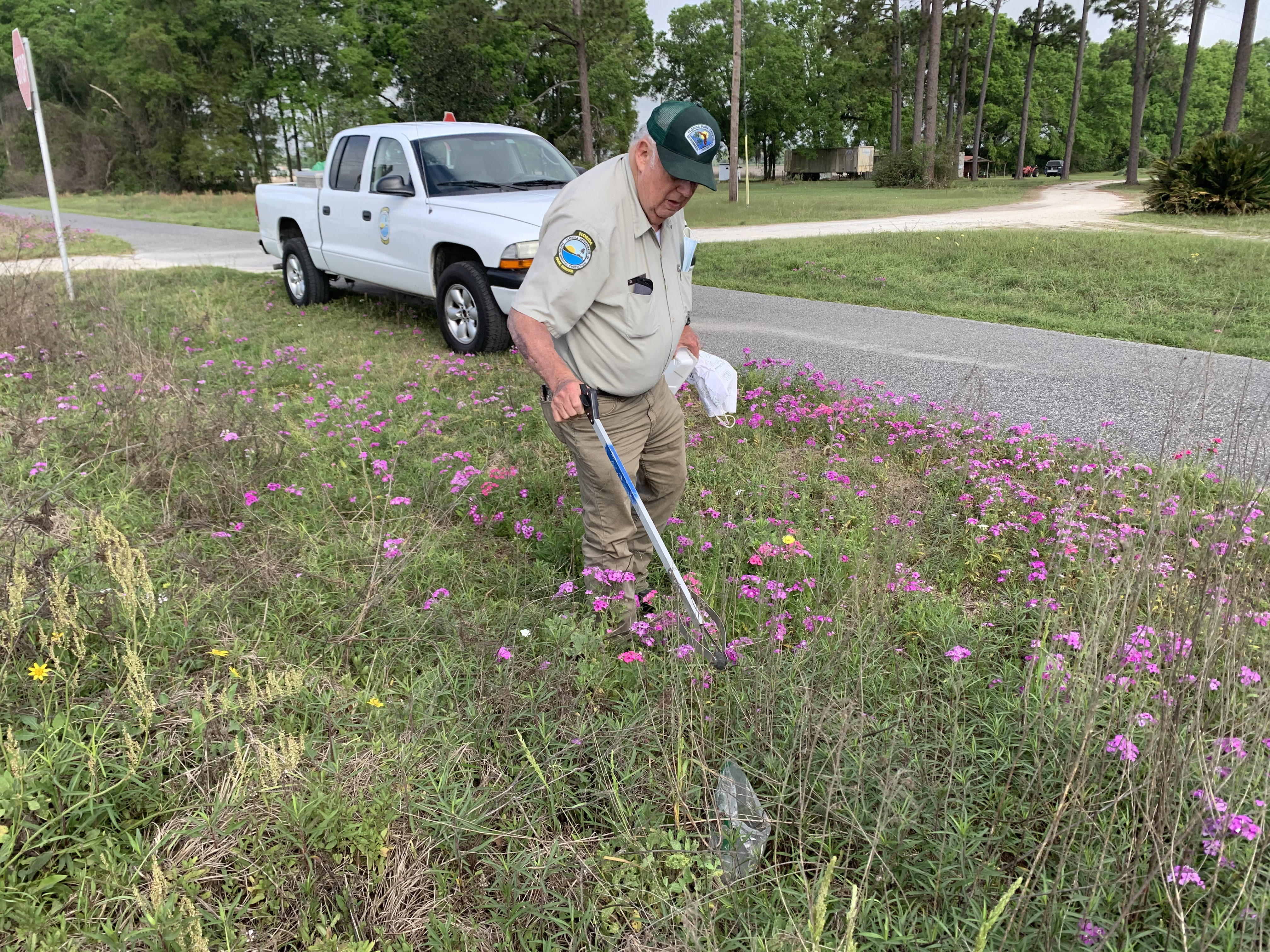 Billy Thomas picking up trash