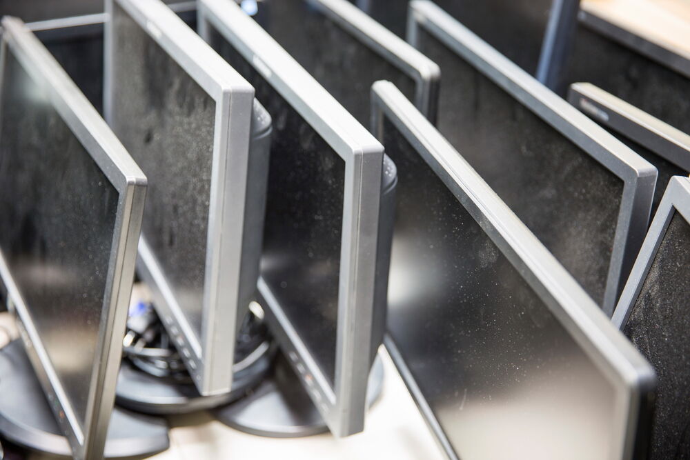 Old computer monitors gathered on the table
