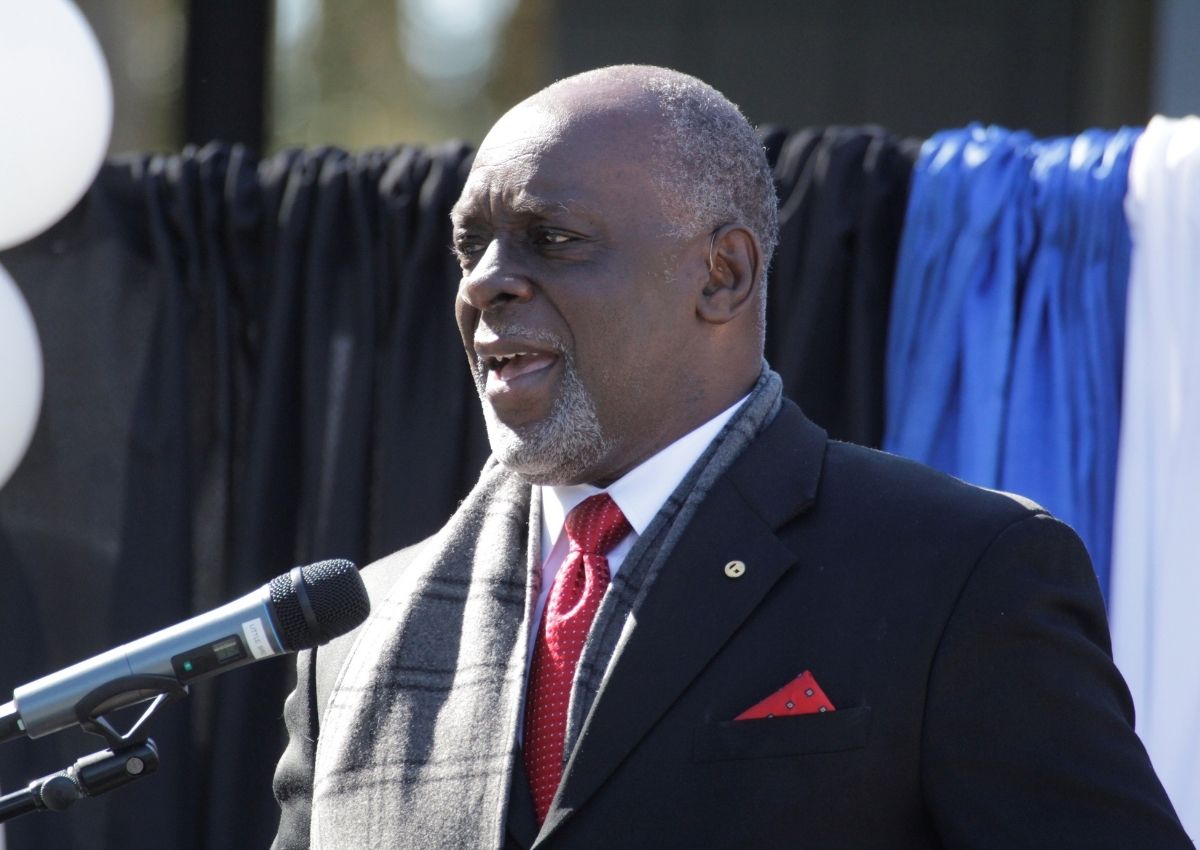 Rev. Carl Smart speaks at microphone