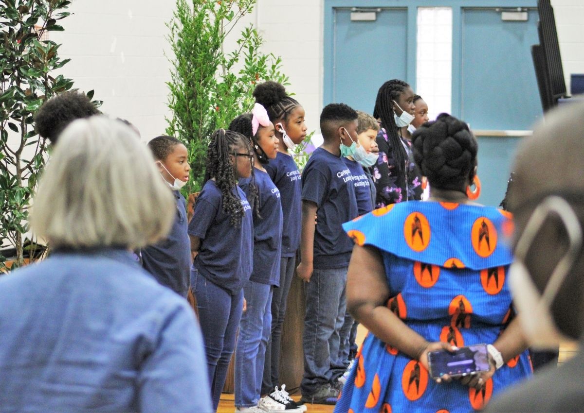 Students of Caring and Sharing Learning School sing