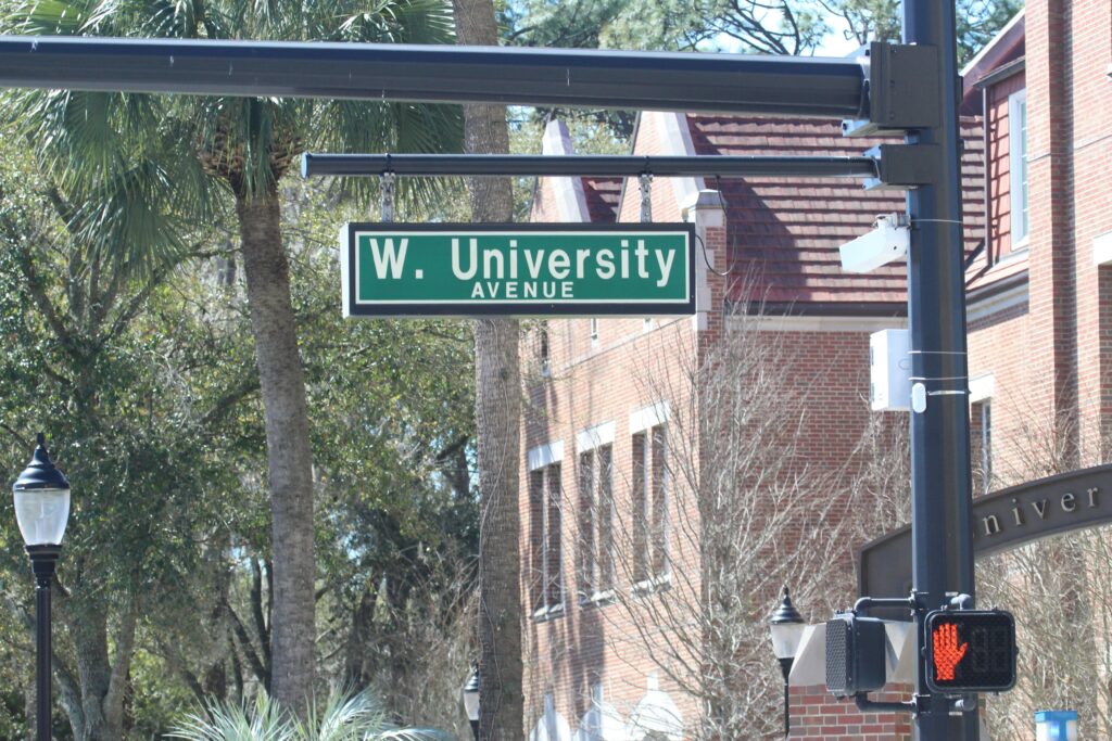 West University Avenue sign in front of University of Florida campus