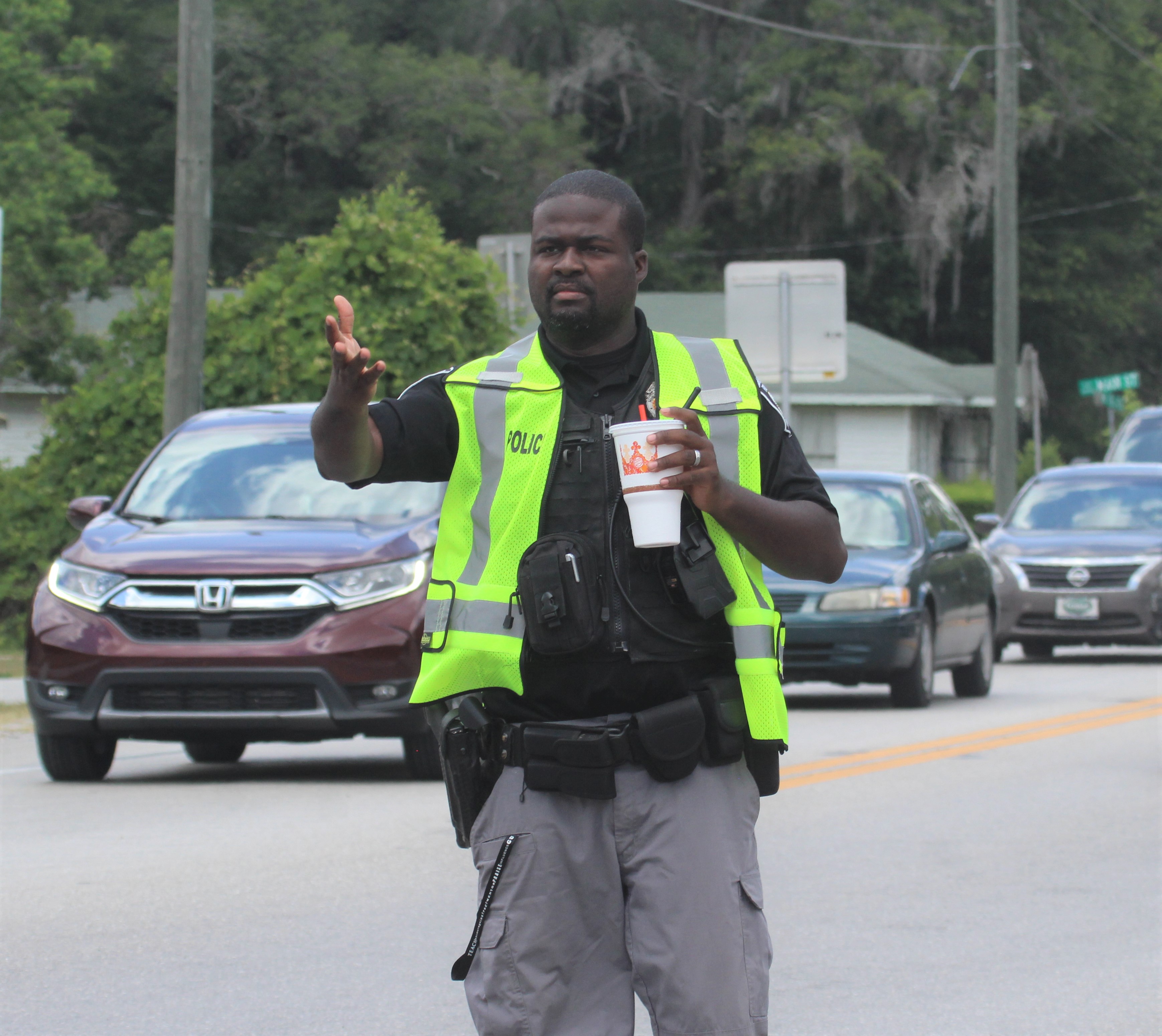 High Springs Police Officer Adam Joy directs traffic