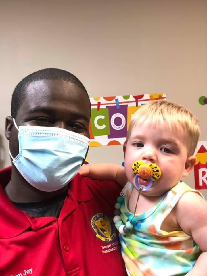 Pastor Adam Joy with baby