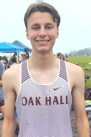 Oak Hall's Caden Montini cross country mug