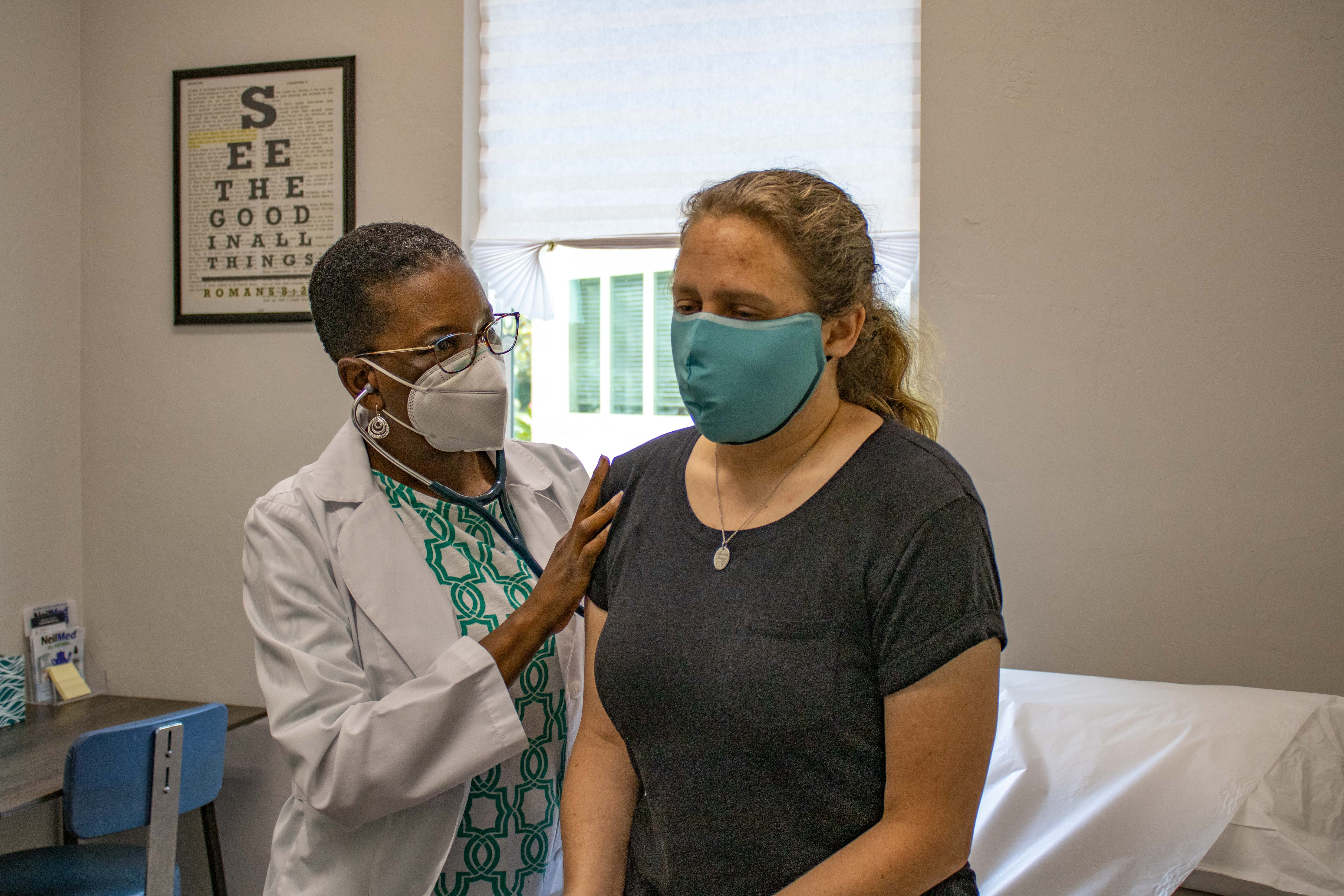 Dr. Althea Tyndall-Smith with a patient
