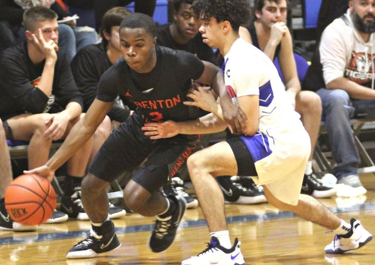 Trenton's Jaron Riley tries to drible around Bronson's Aneury Montero