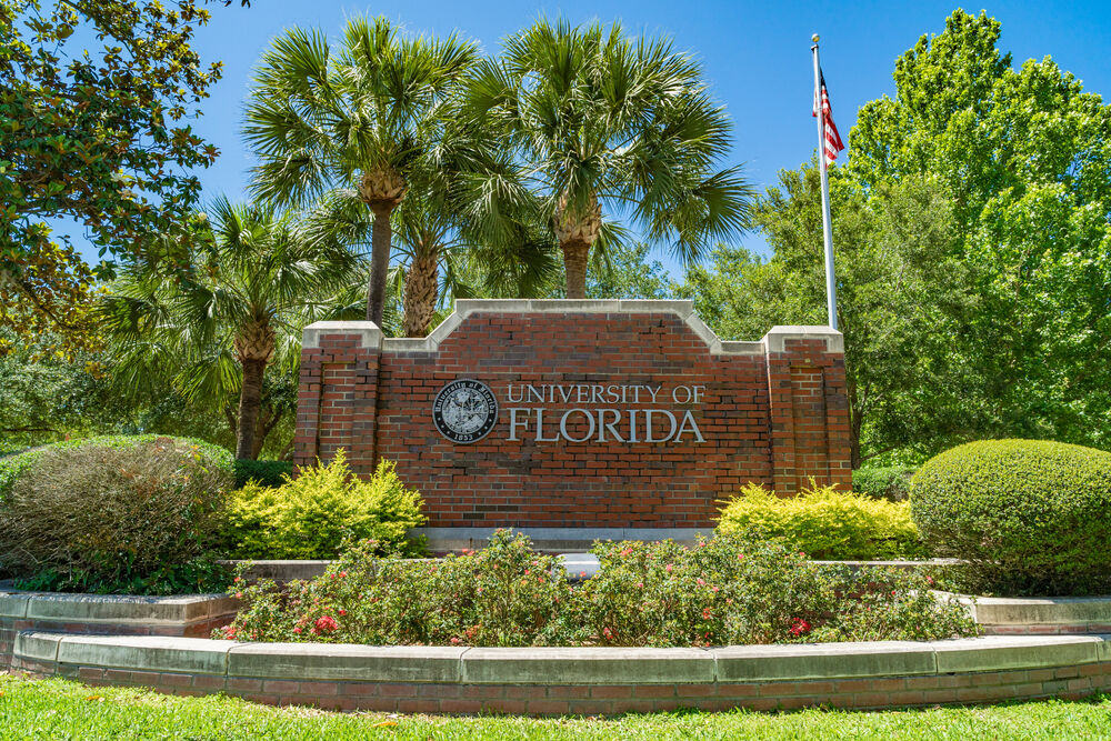 University of Florida brick sign with American flag