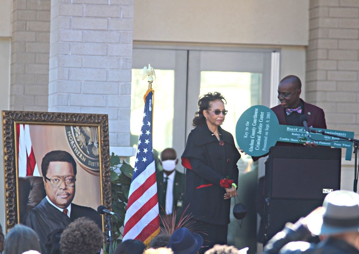 Rodney Long presents Evelyn Mickle with key