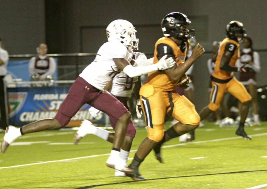 Hawthorne's Tyler Jefferson runs for a touchdown.