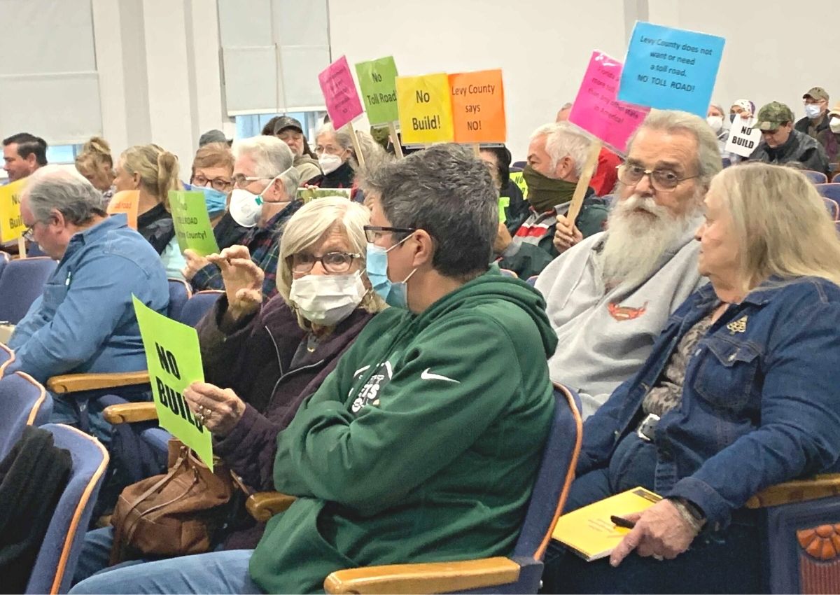 Crowd at Levy BOCC with No Build signs