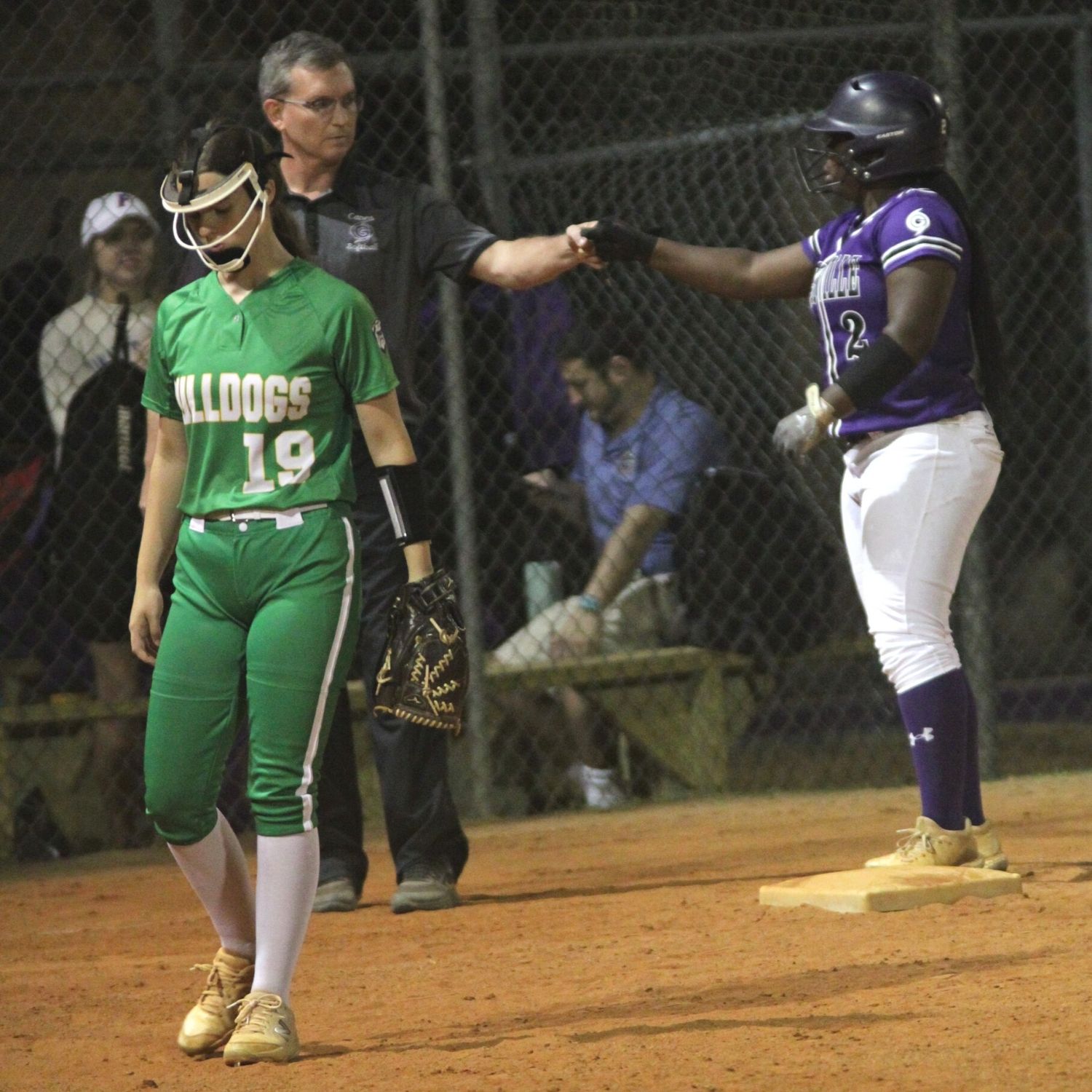 GHS coach Chris Chronister congratulates Parris Wiggs on sixth inning no out triple