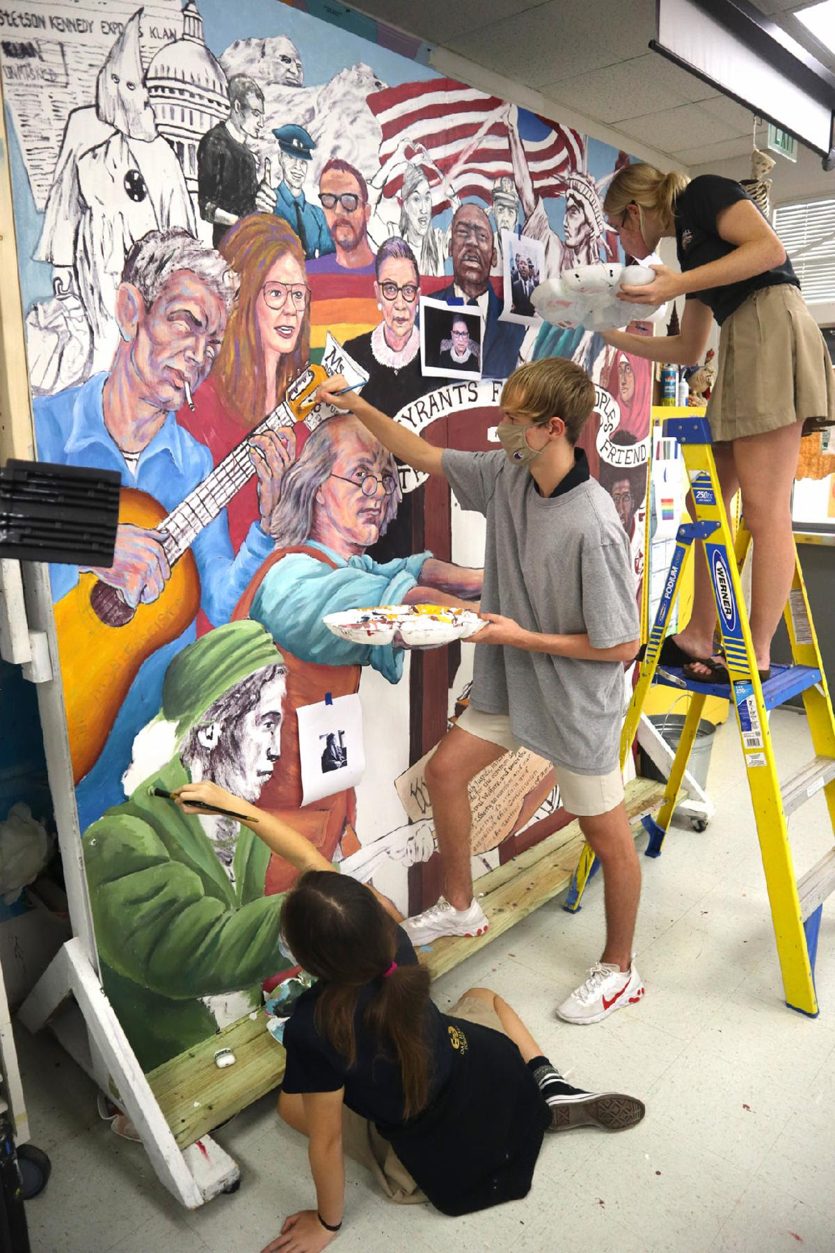 Robert Ponzio painting on a wall