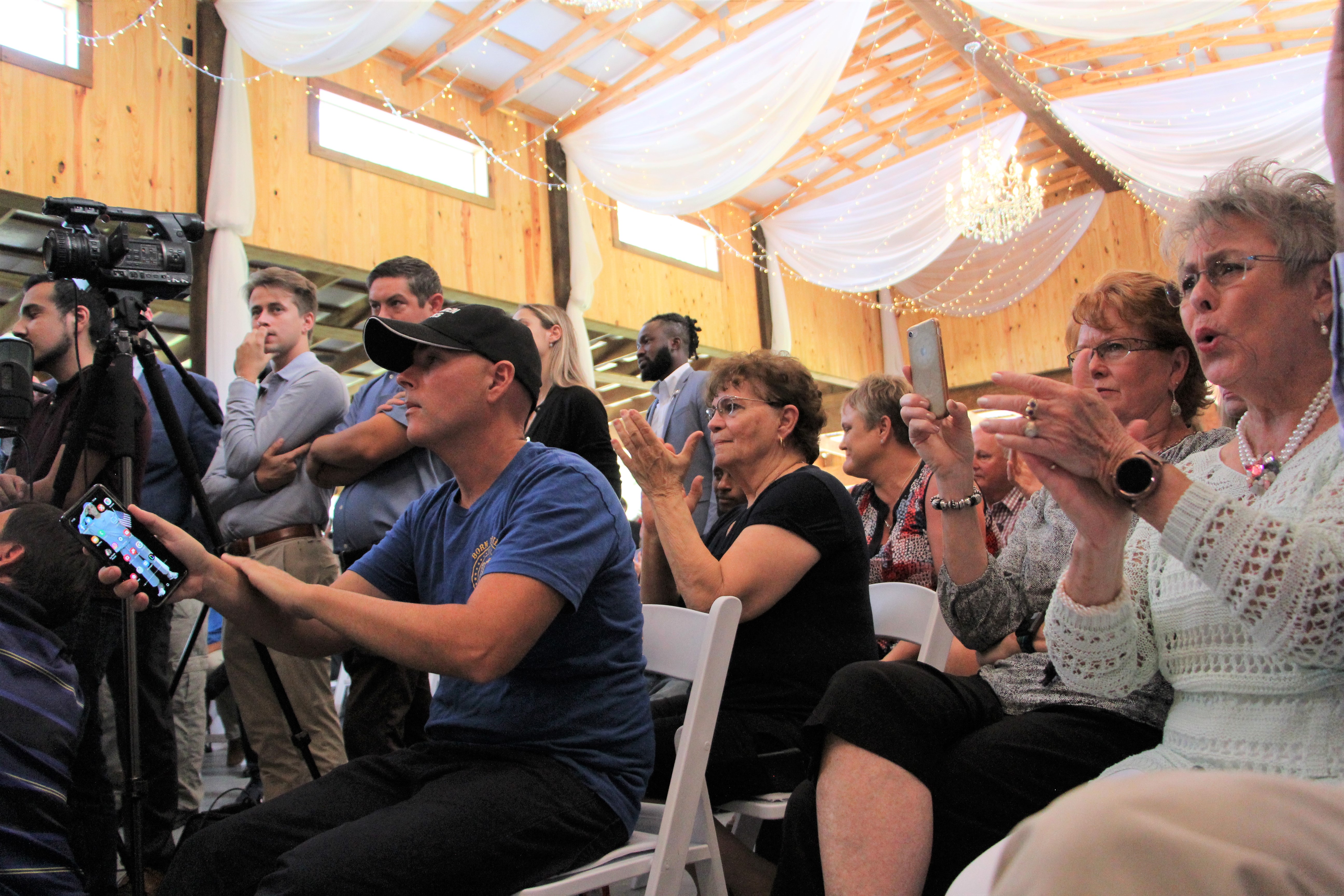 Crowd for press conference at Clark Plantation
