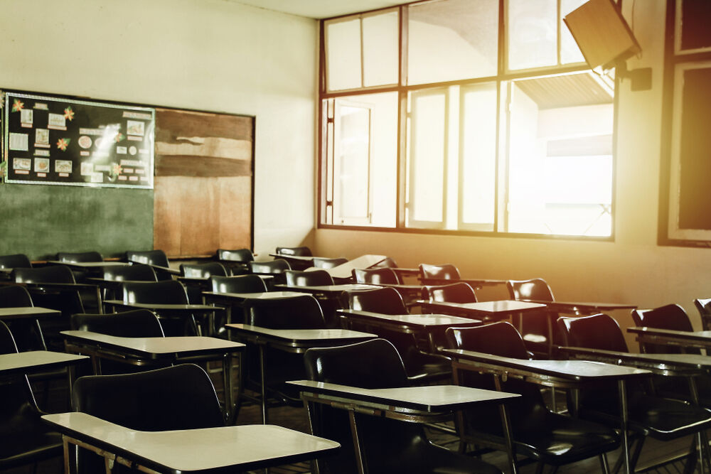 Empty classroom with sunlight coming in window