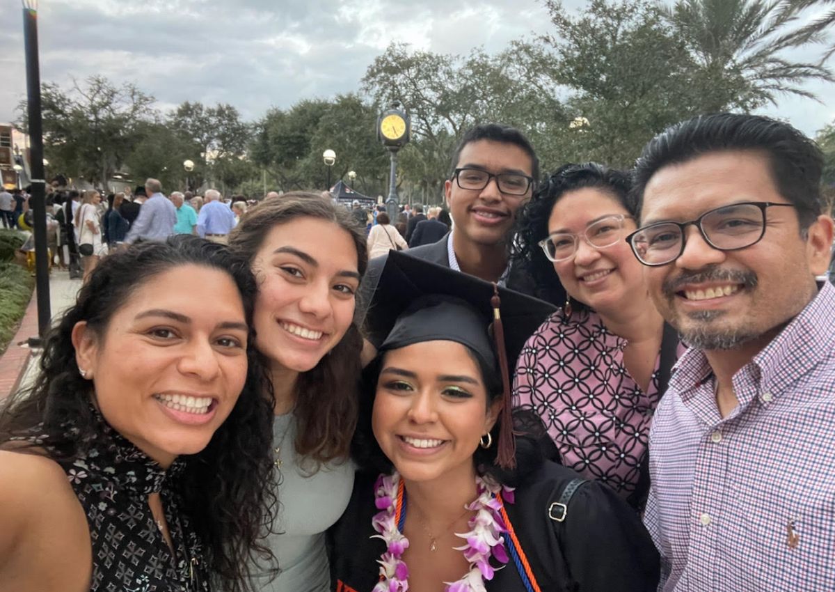 Sabrina and her family celebrating her graduation..jpg