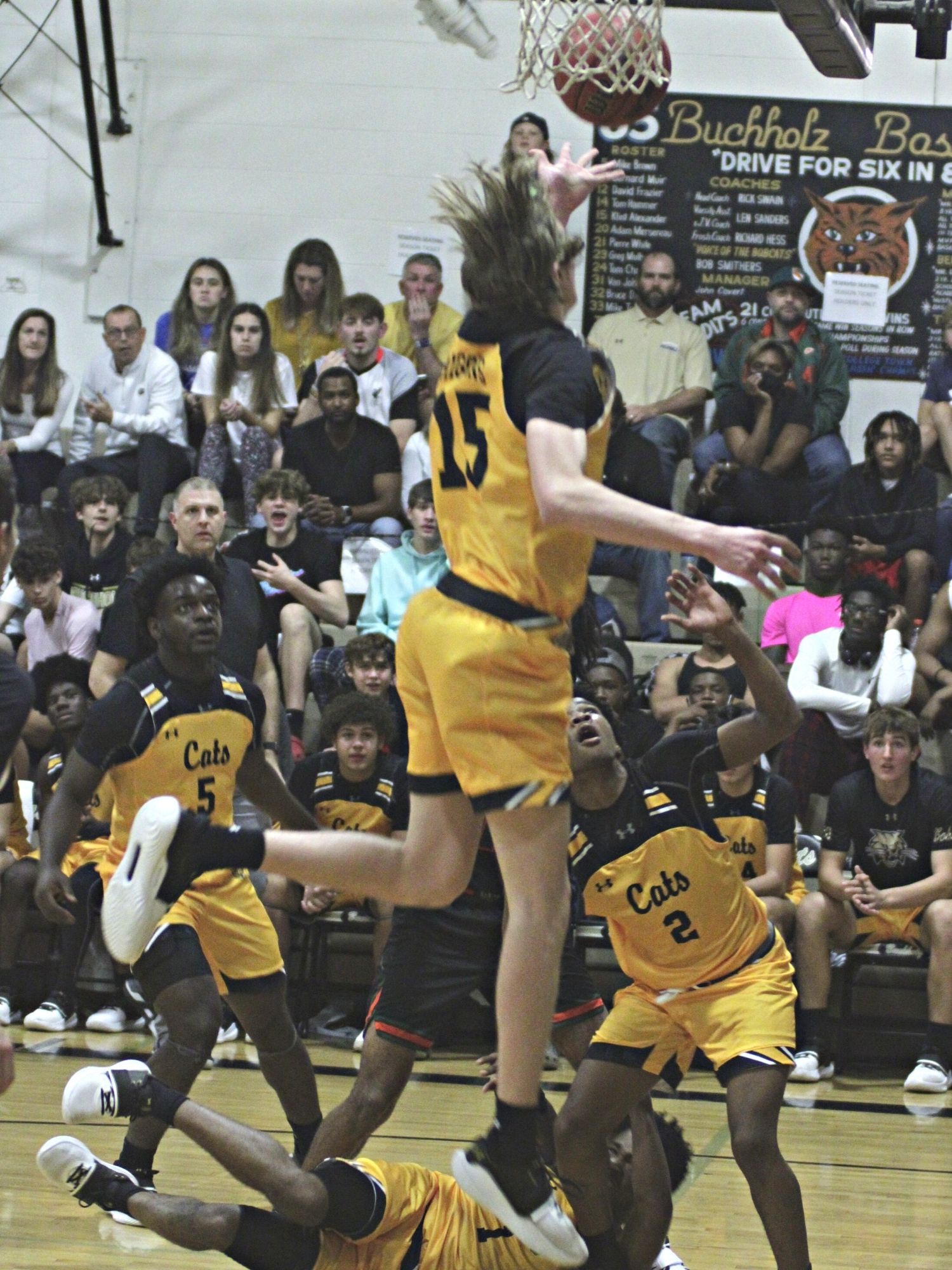 Buchholz's Taybin Riggins goes for a rebound