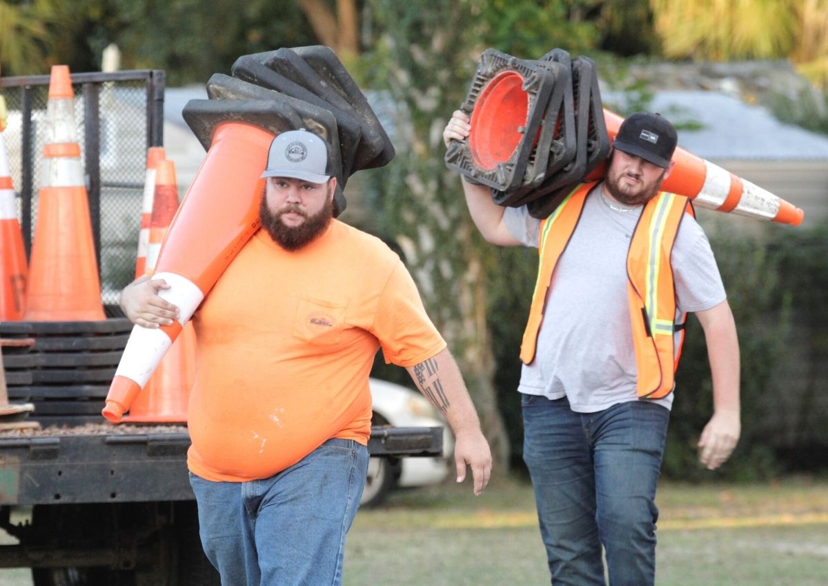 Newberry city workers Aspen Pritchard-Hobbs and Brian Worley (right) at Christmas parade