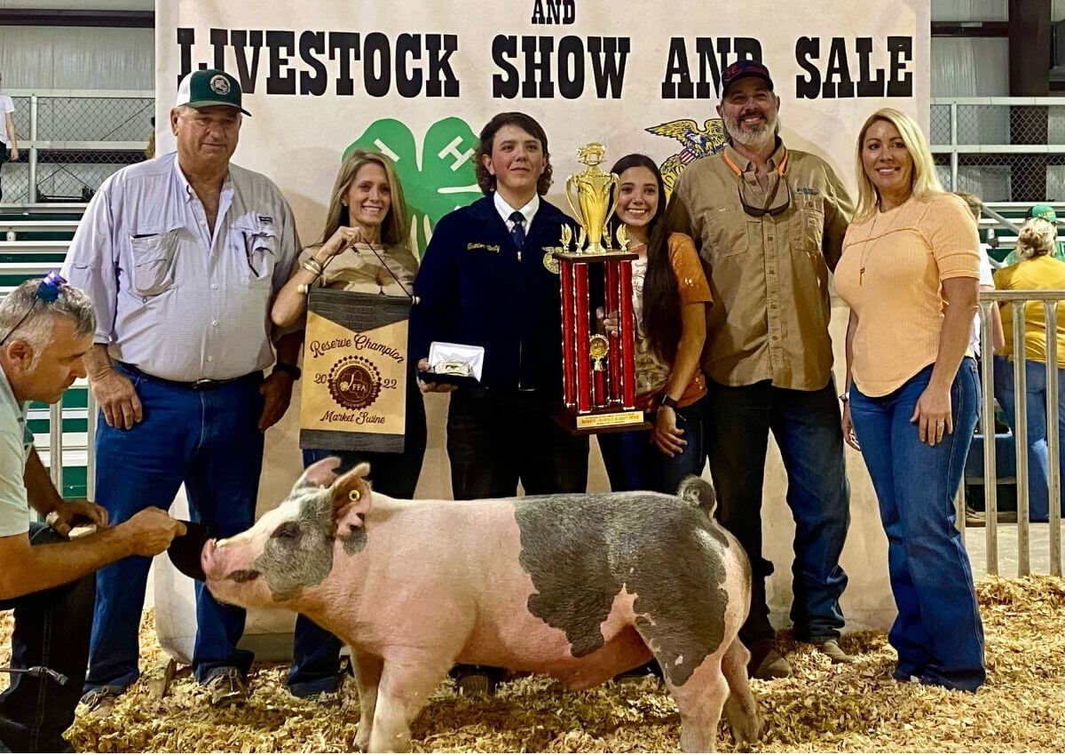 Trenton Beaty poses with his Reserve Champion swine