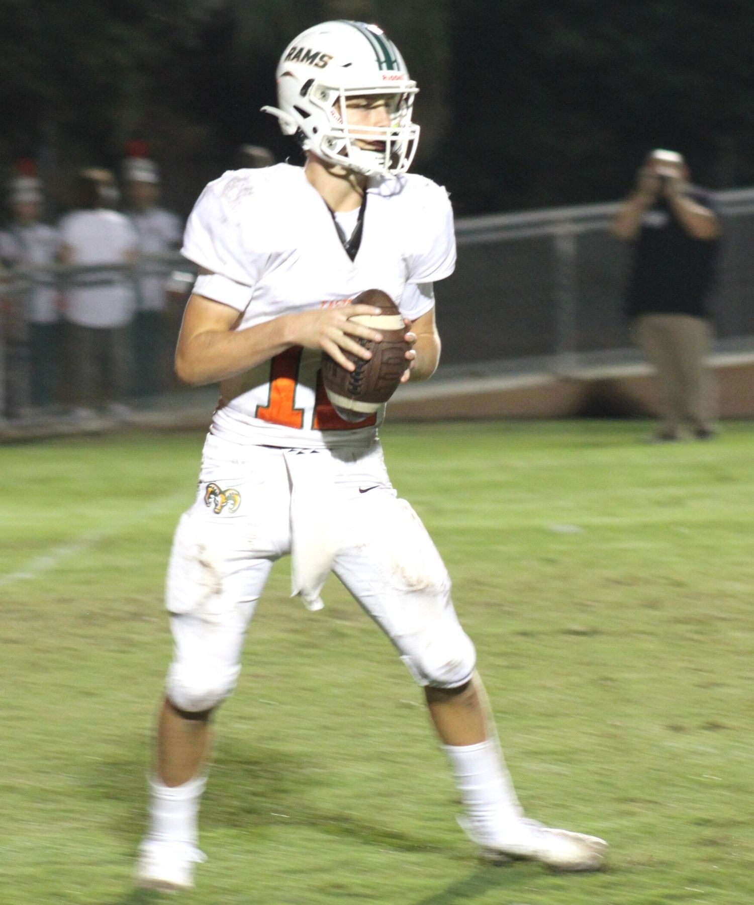 Eastside QB Holden Johnson holds football in white uniform