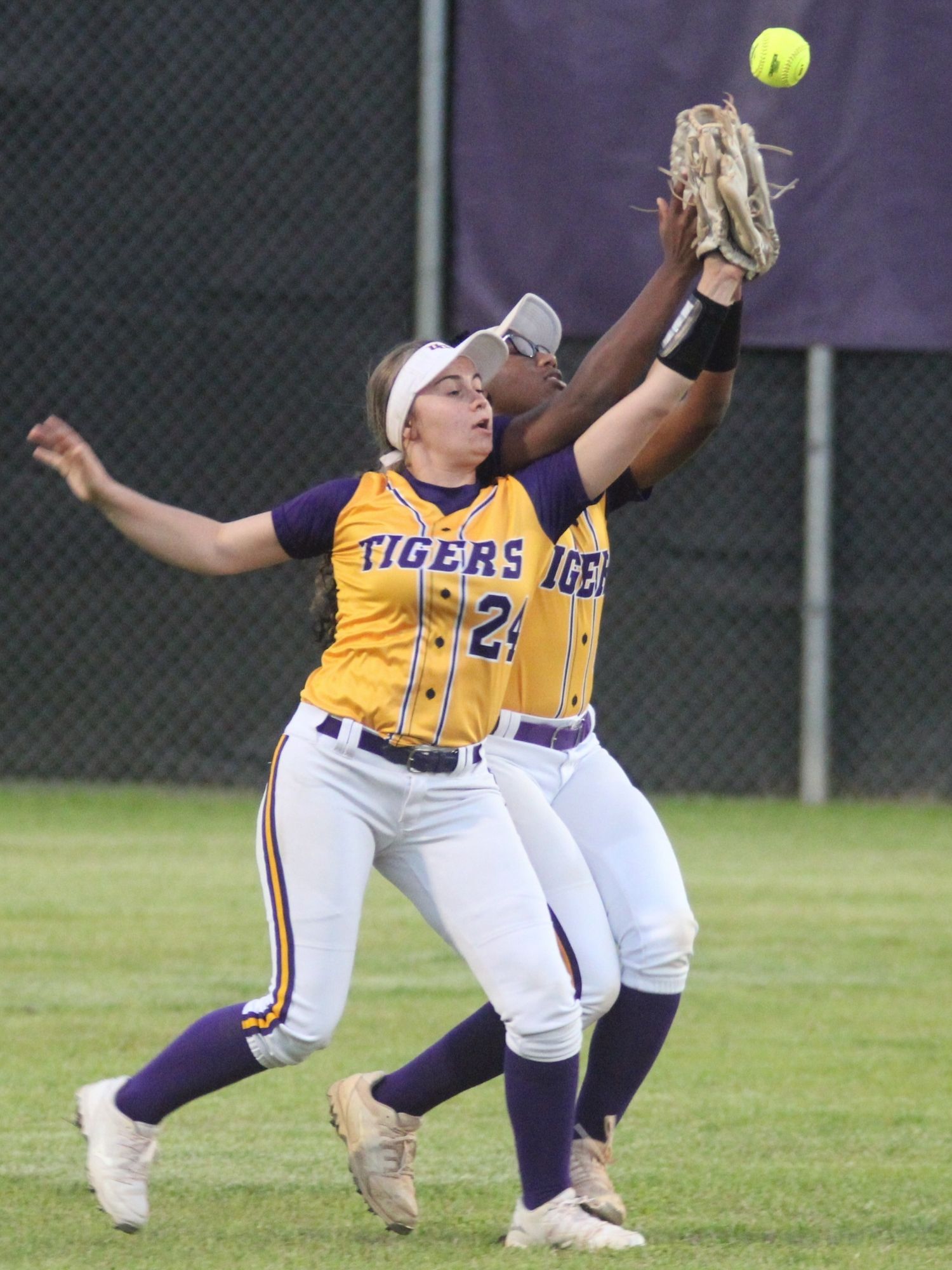 Union County outfielders Hayley Burke (24) and Angela Tucker collide in the bottom of the third