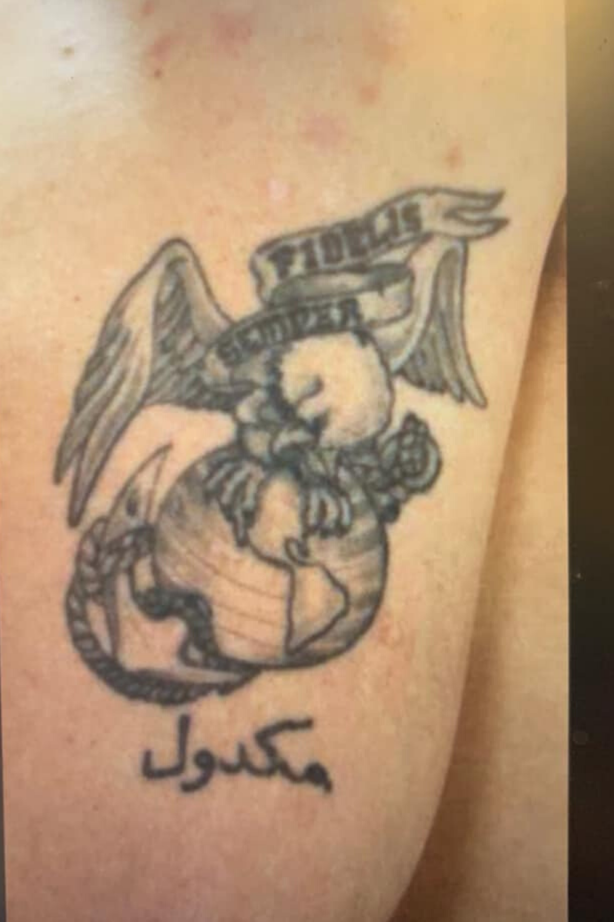 Patrick McDowell arm tatoo