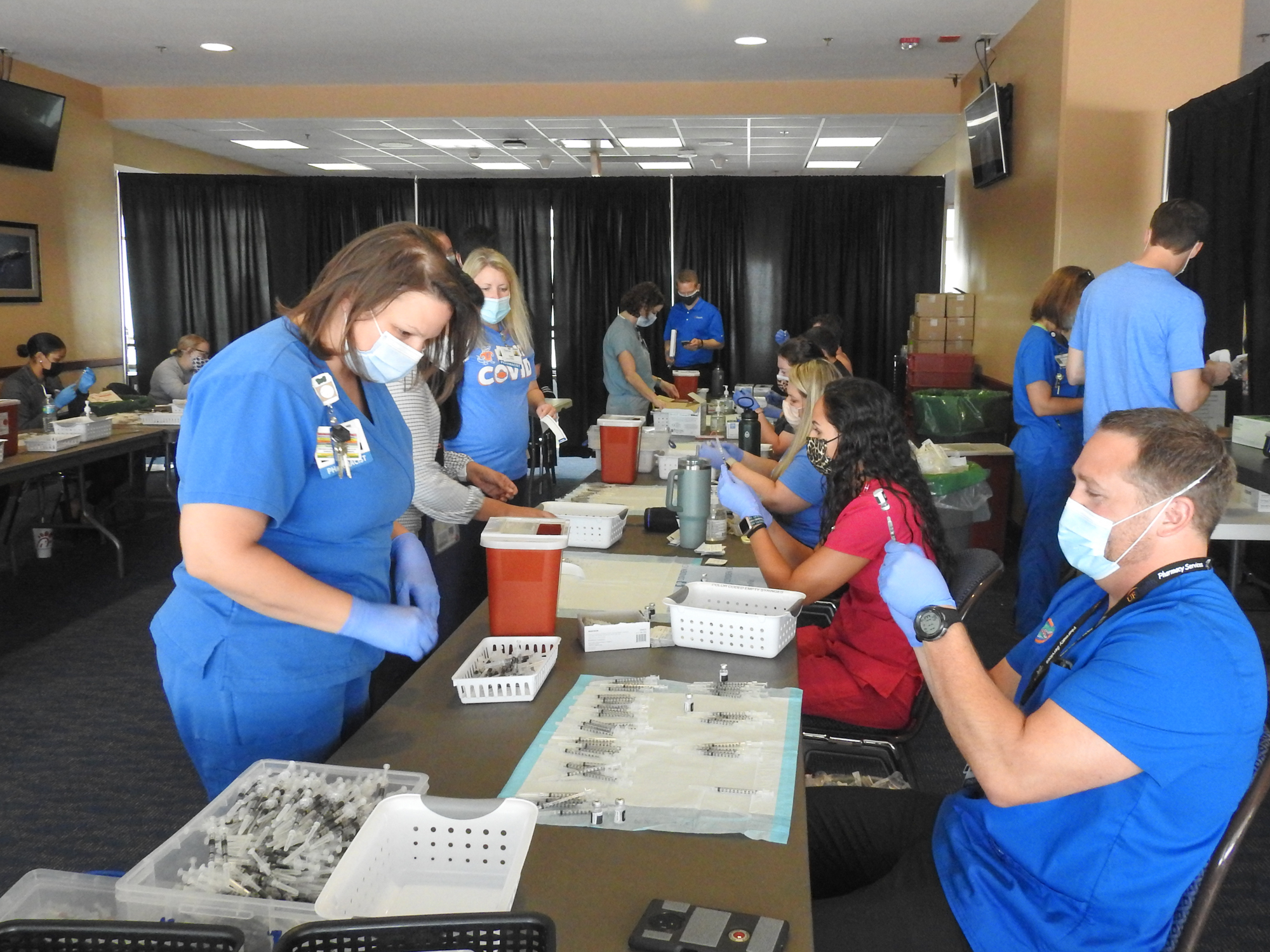 Staff prepping vaccine doses