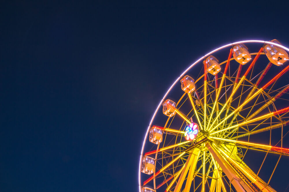 Lighted ferris wheel against night sky