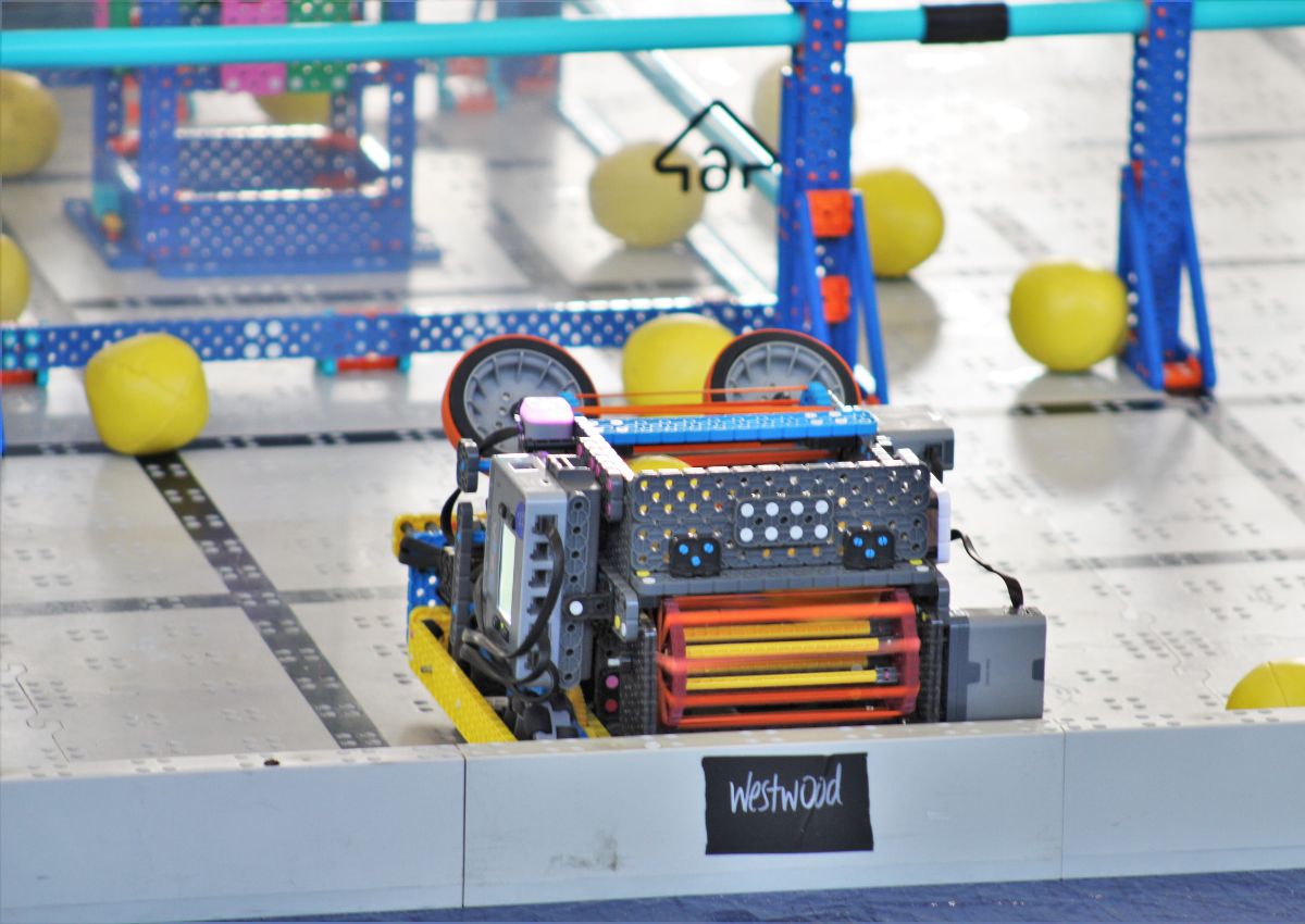 Vehicles collect and launch balls from around the arena