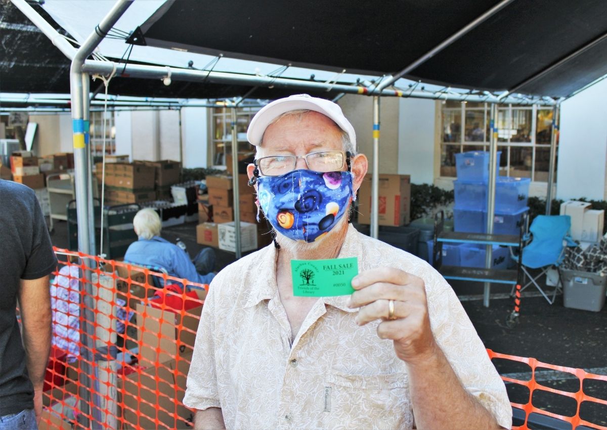Lloyd Davis with his No. 50 ticket at the FOL Book Sale.