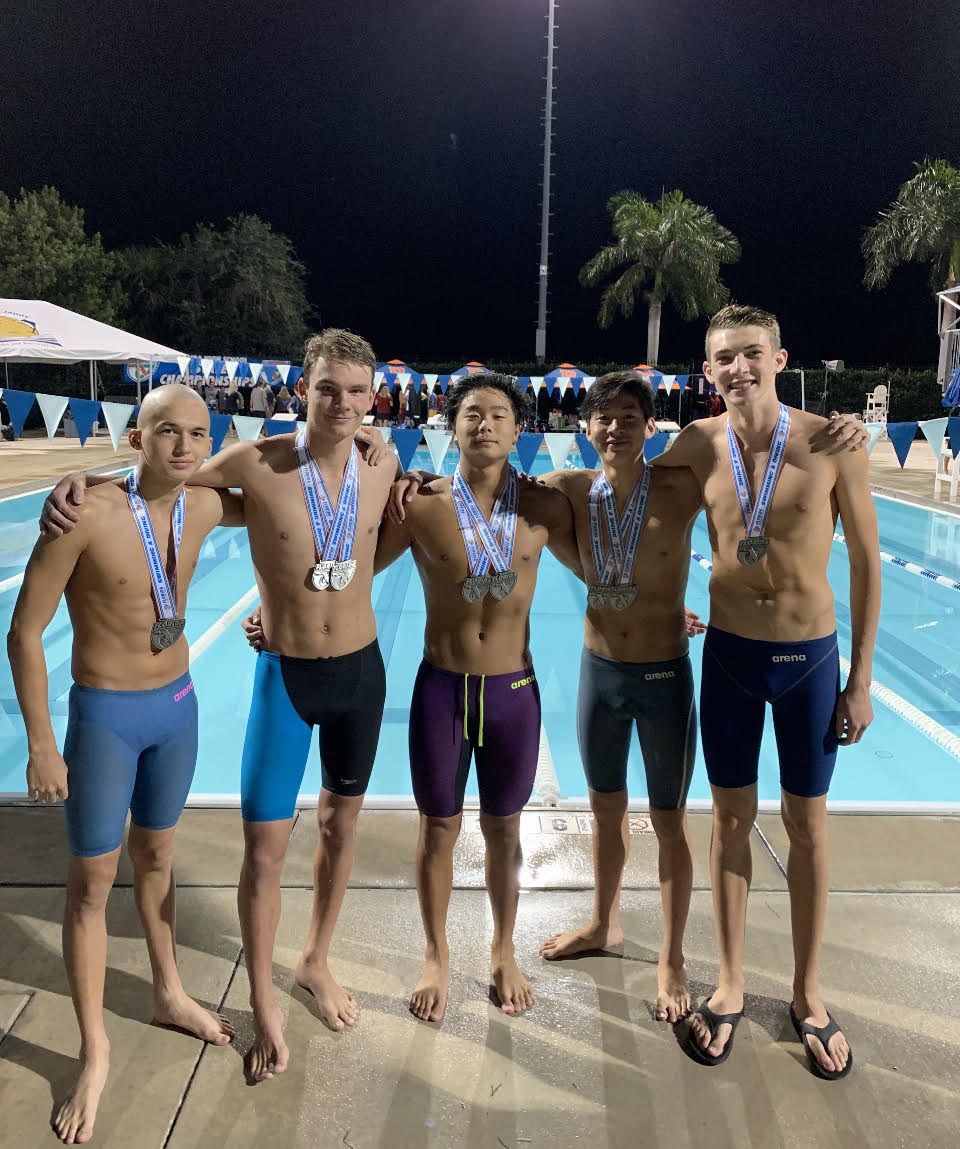 Brandon Jeong and P.K. Yonge swim team