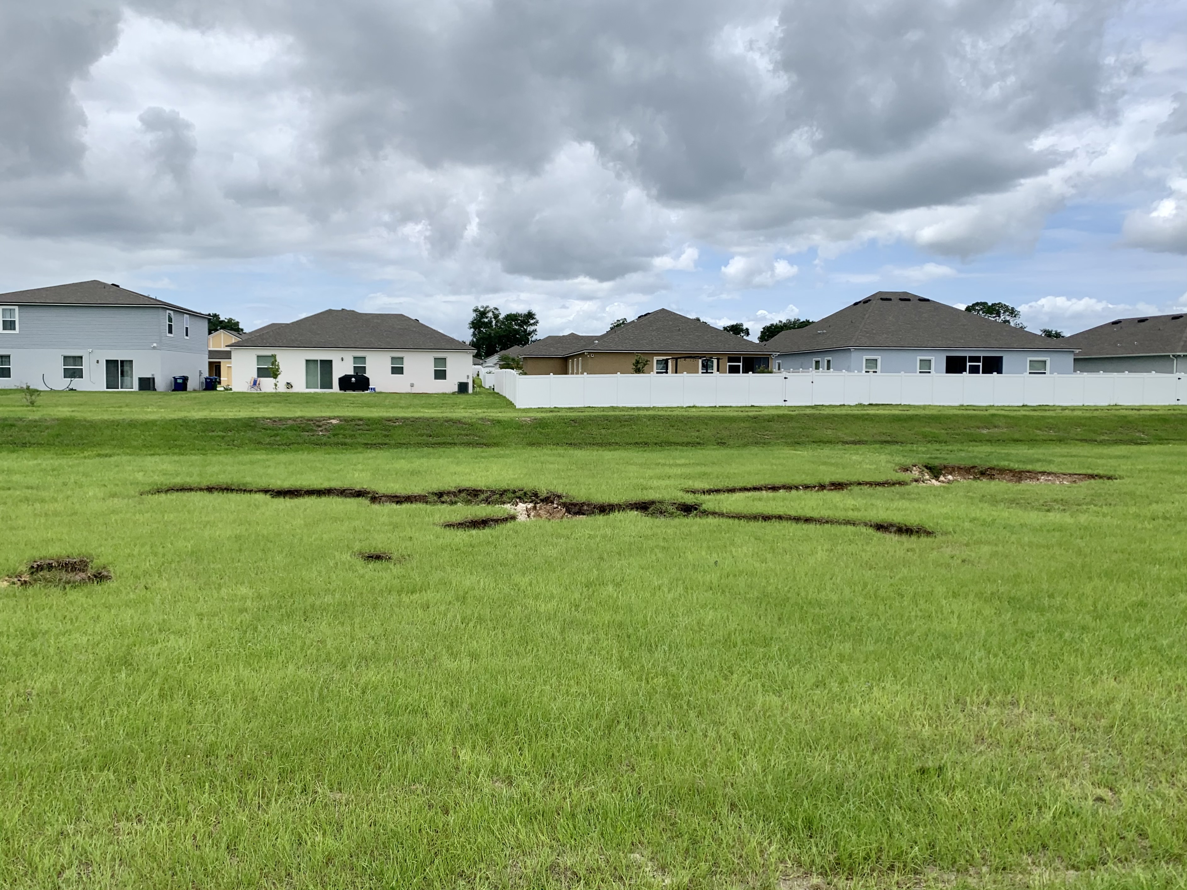 Newberry sinkhole with homes in background