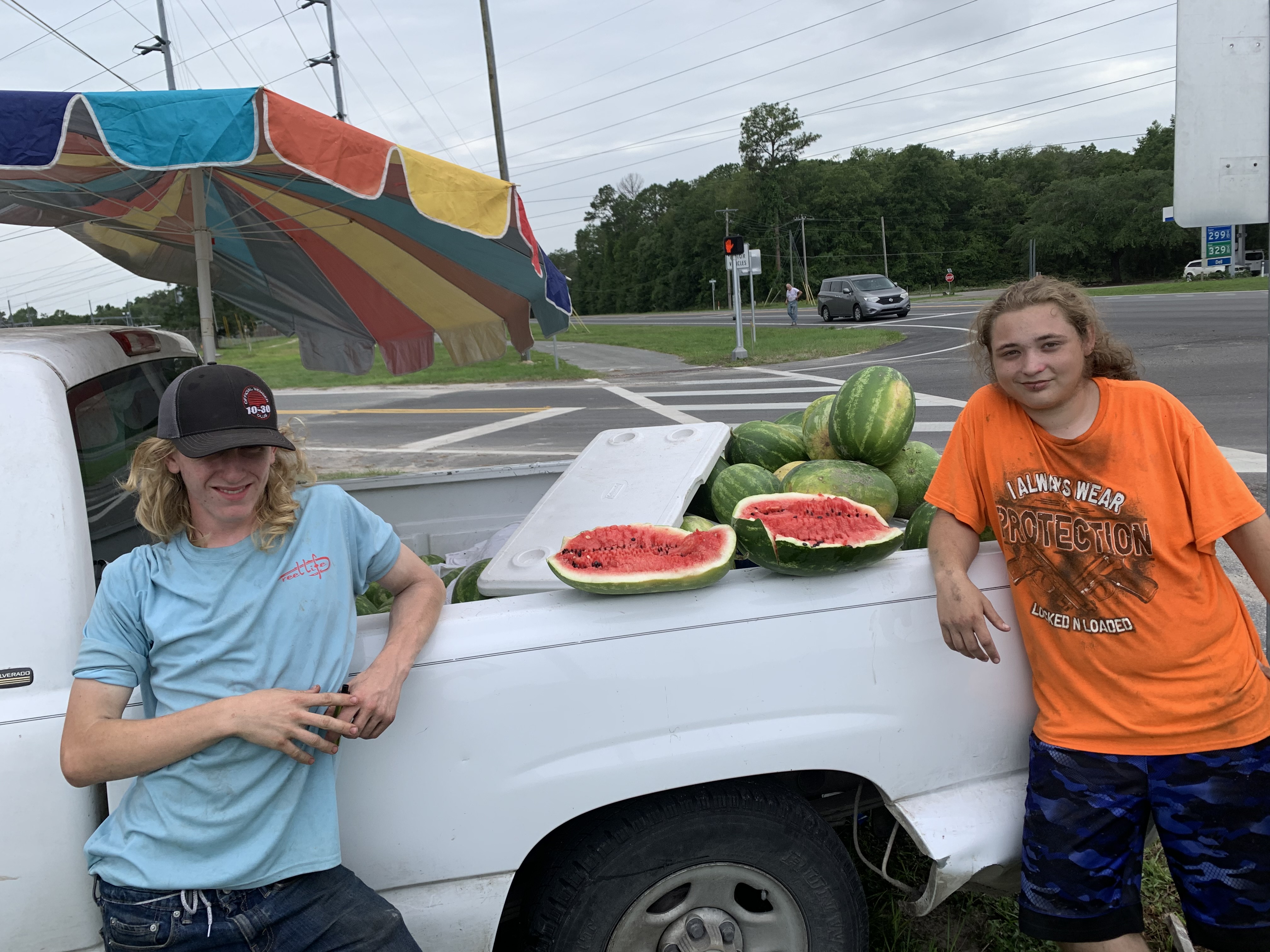 Ethan Keene and Wyatt Hooten sell watermelons from a truck