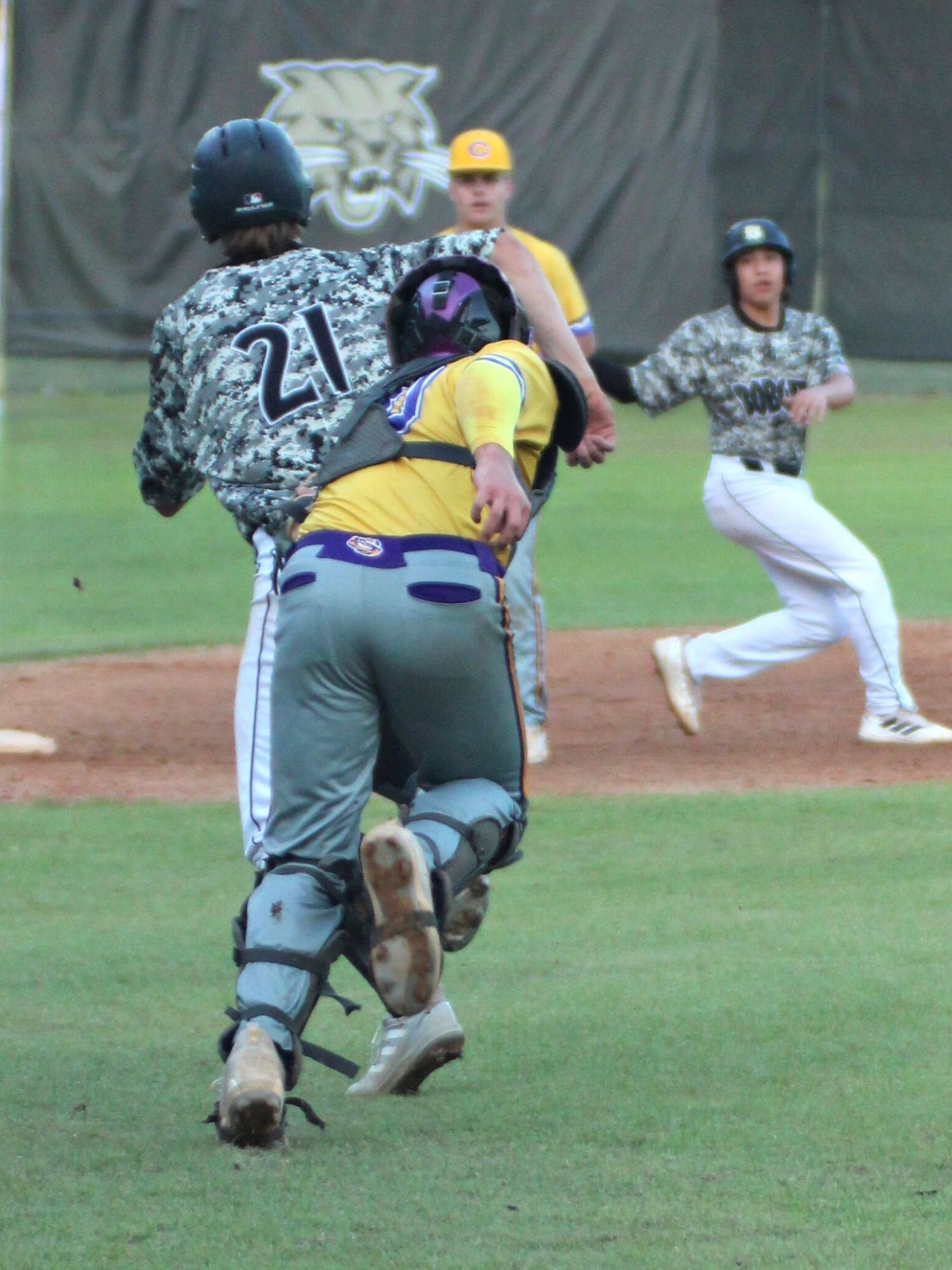 Columbia's Brent Howard tags Buchholz's Anthony Wilkie for out