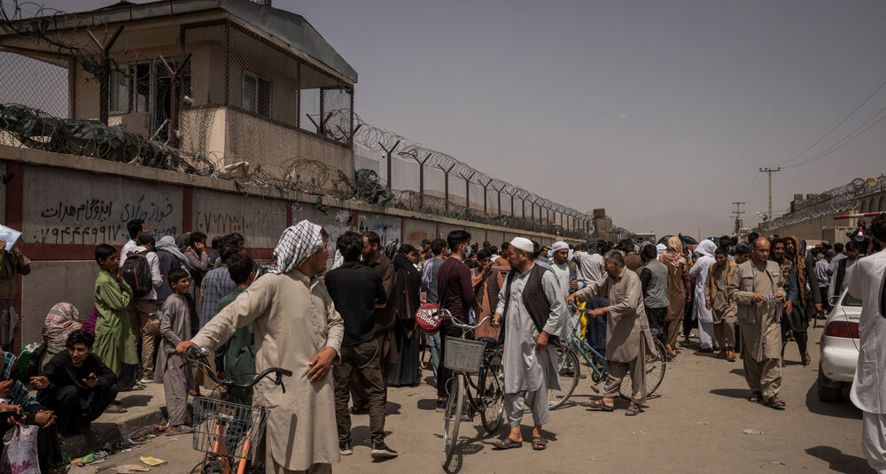 Crowds continue to gather outside Hamid Karzai International Airport in Kabul, Afghanistan, even after a bombing killed at least 182 people on Thursday.