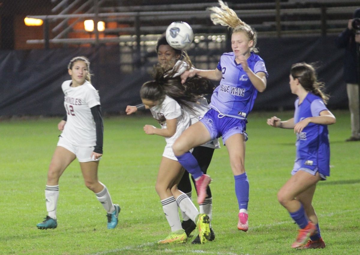 PK Yonge's Faith Hardy battles for the ball