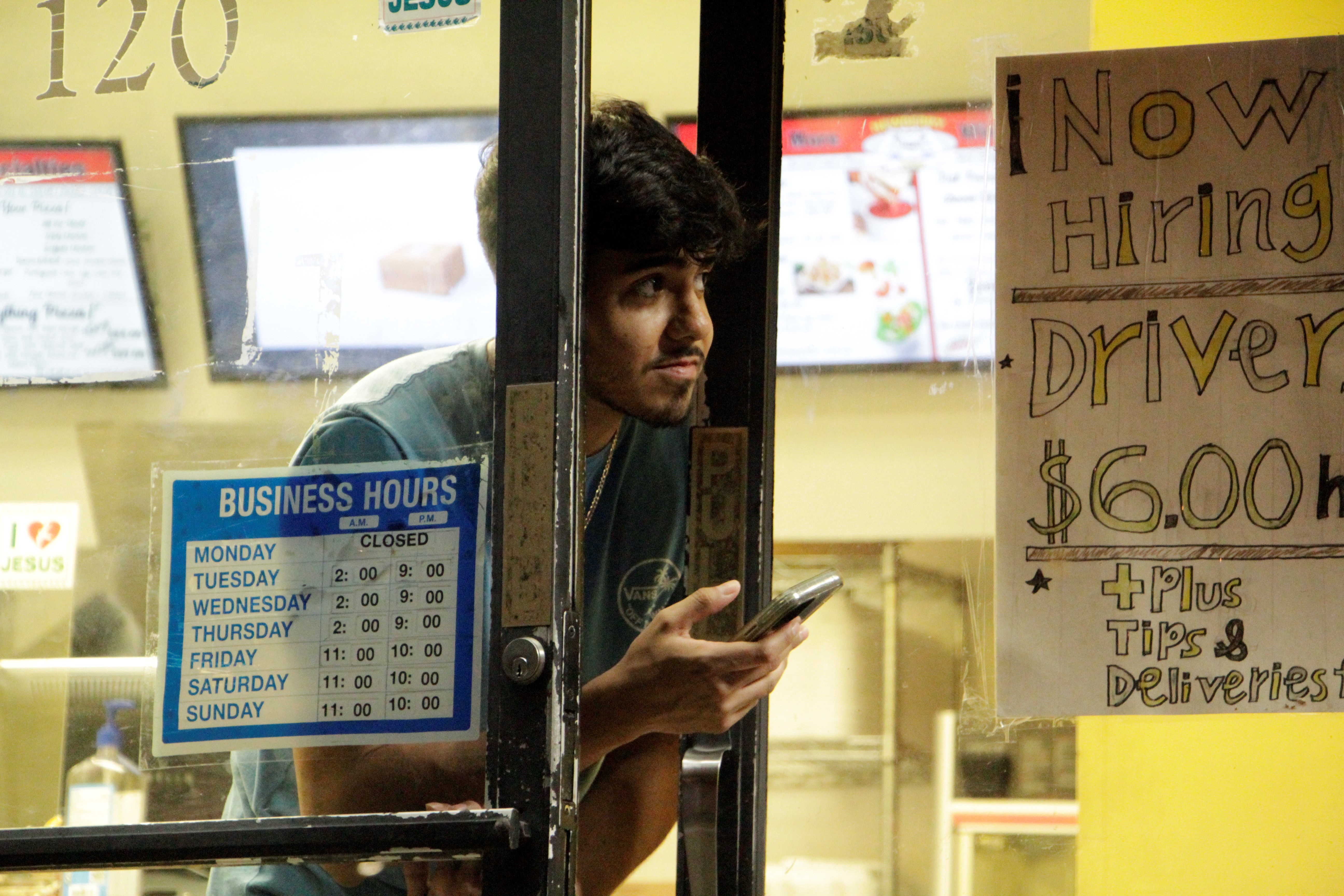 Newberry Pizza employee looks to see if coast is clear after shooting