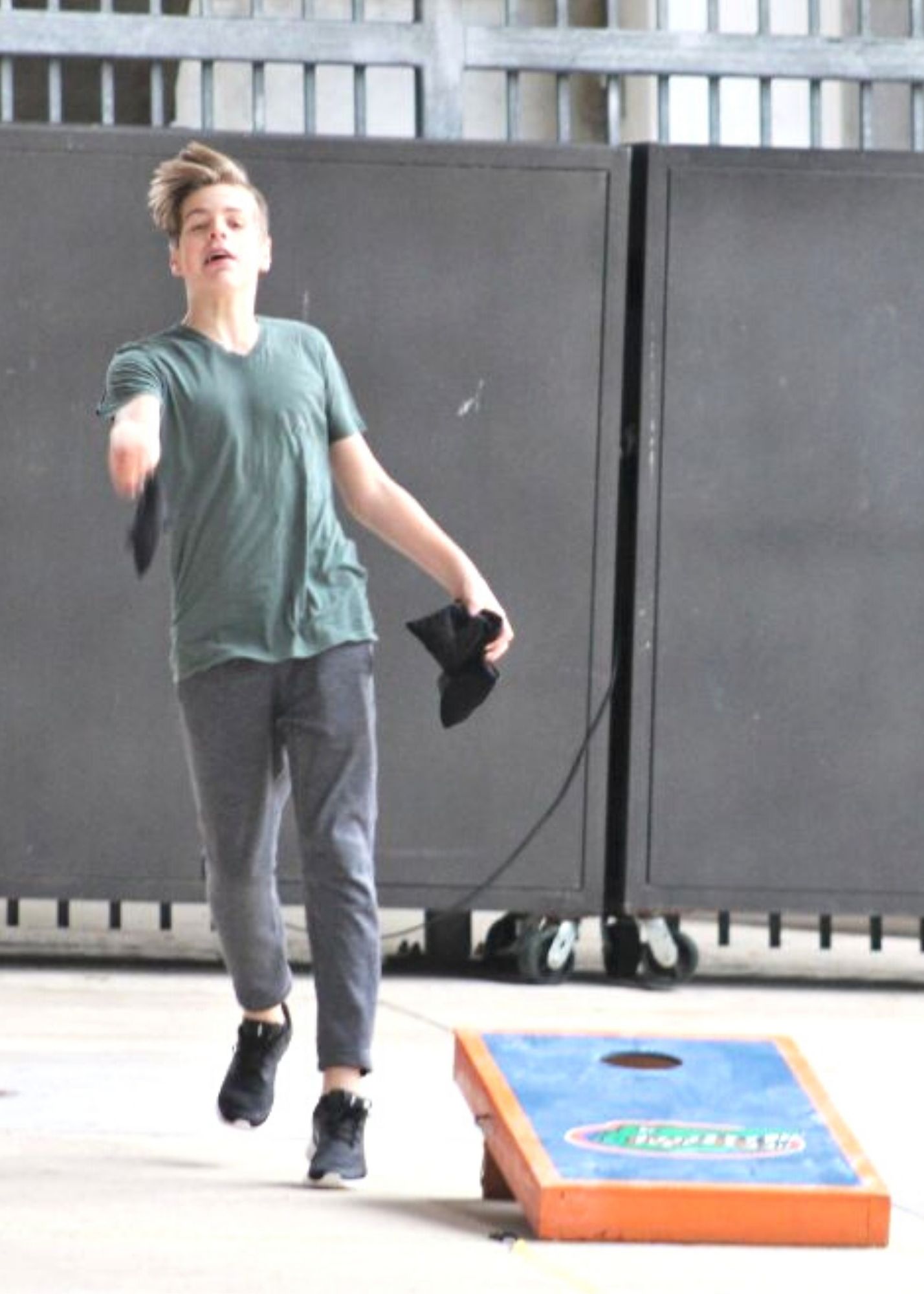 Justin Gordon attempting longest corn hole toss.