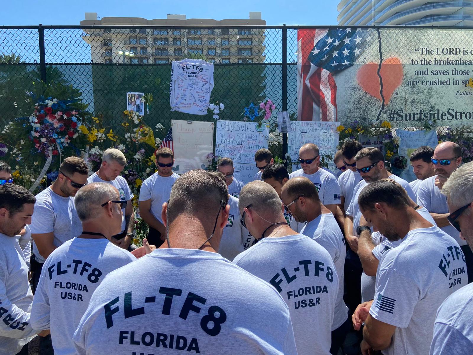 Members of USAR Task Force-8 pay respects at Surfside memorial