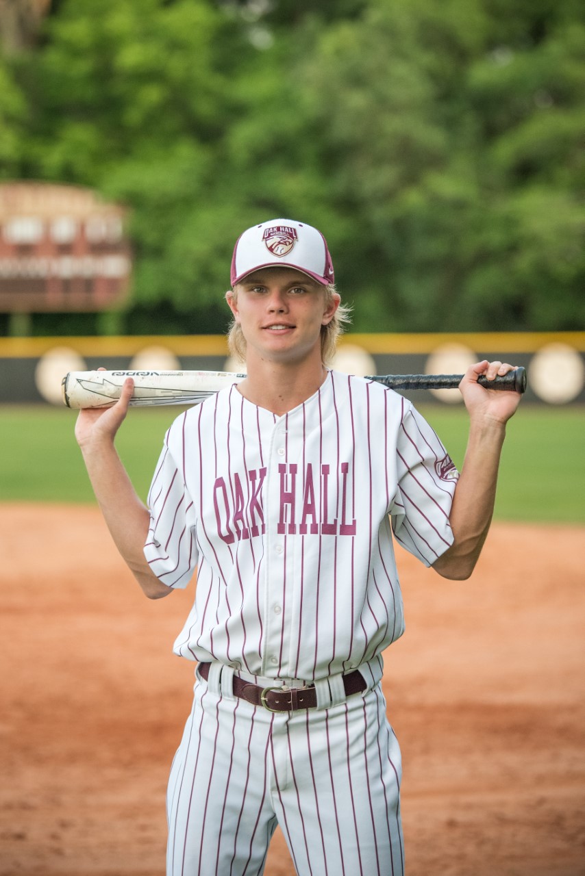 Andrew Pickens of Oak Hall holding baseball bat