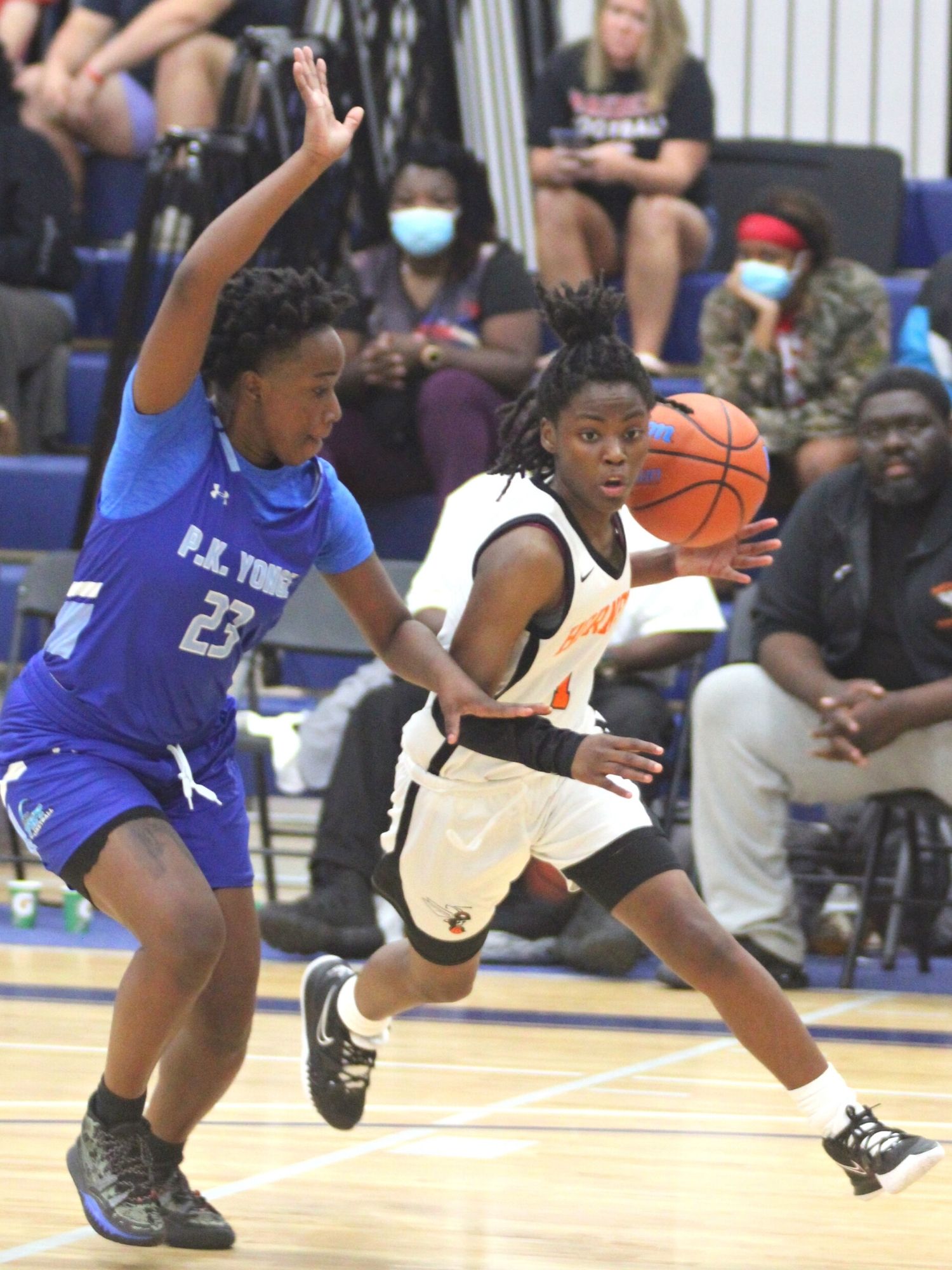 Hawthorne's De'Mya Adams drives by P.K. Yonge's Dee Goldwire