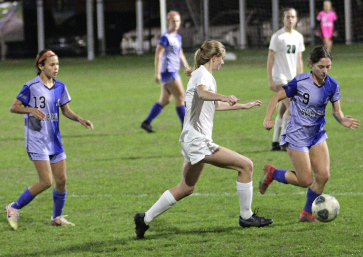 P.K. Yonge's Sally Schackow goes after ball.
