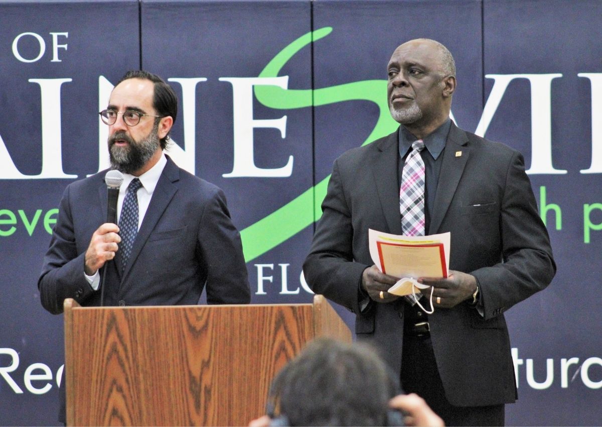 Pastor Andy Bachman, left, and Rev. Carl Smart perform the reading of names.