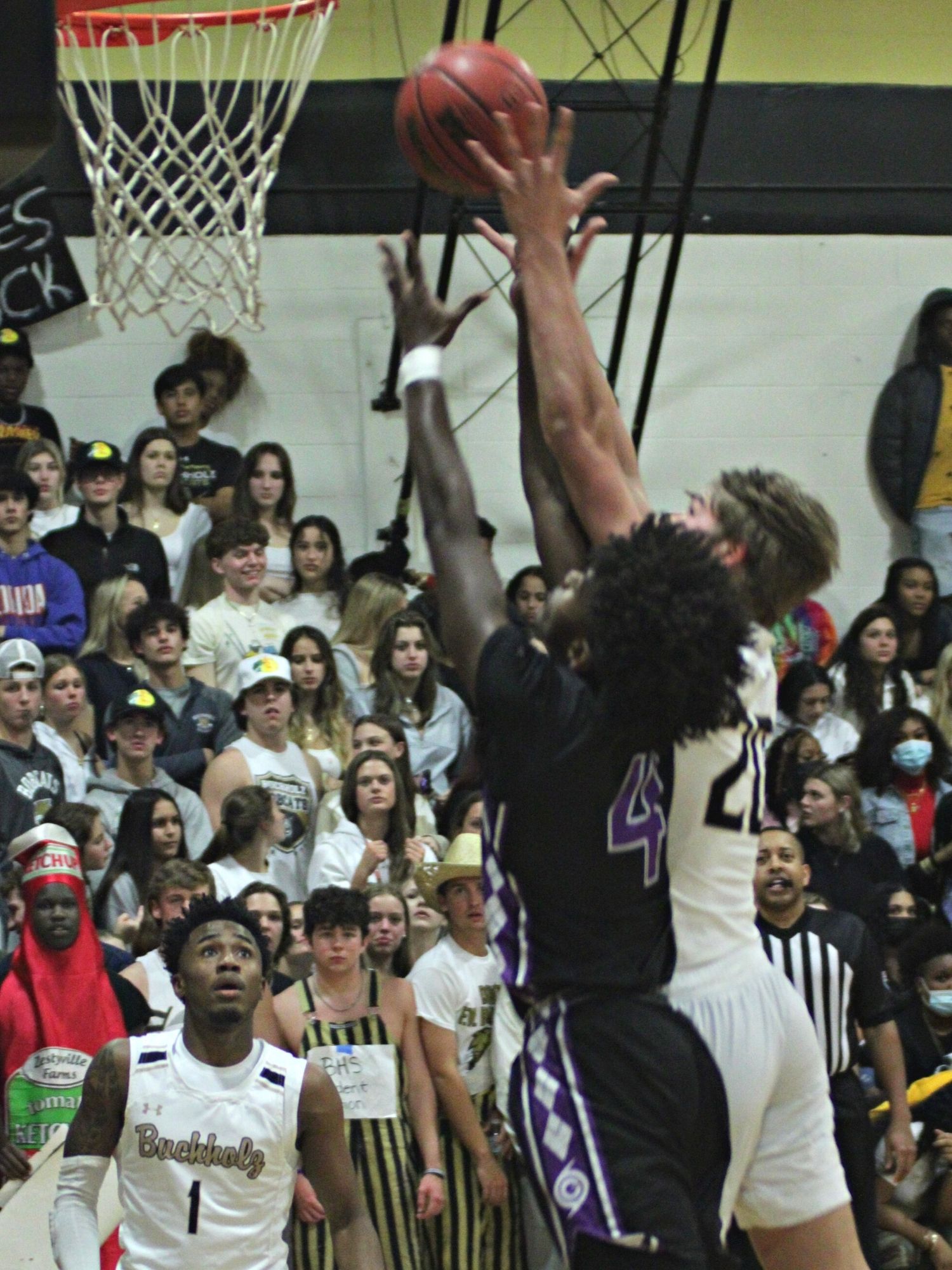 Gainesville's RJ Hines contests Buchholz's Anthony Wilkie's shot