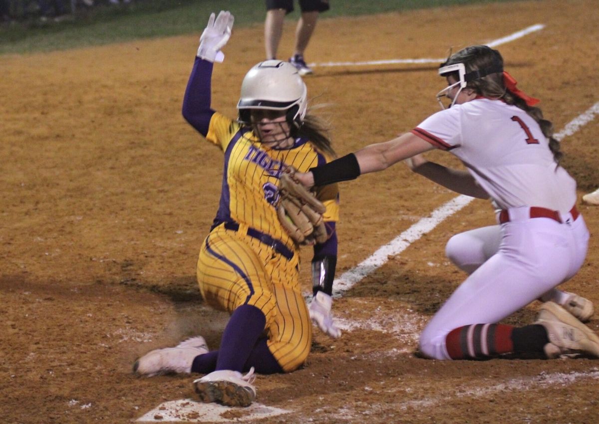 Williston pitcher Makenna Boyd tags Union County's Hayley Burke out in 7th inning