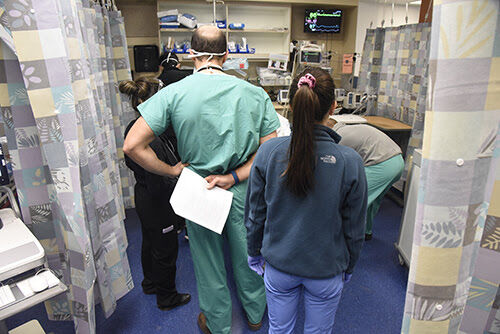UF Health Jacksonville staff care for a patient in the emergency room.